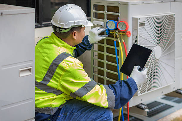 Professional Heat Pump Repair technician working in Cedar Falls, IA